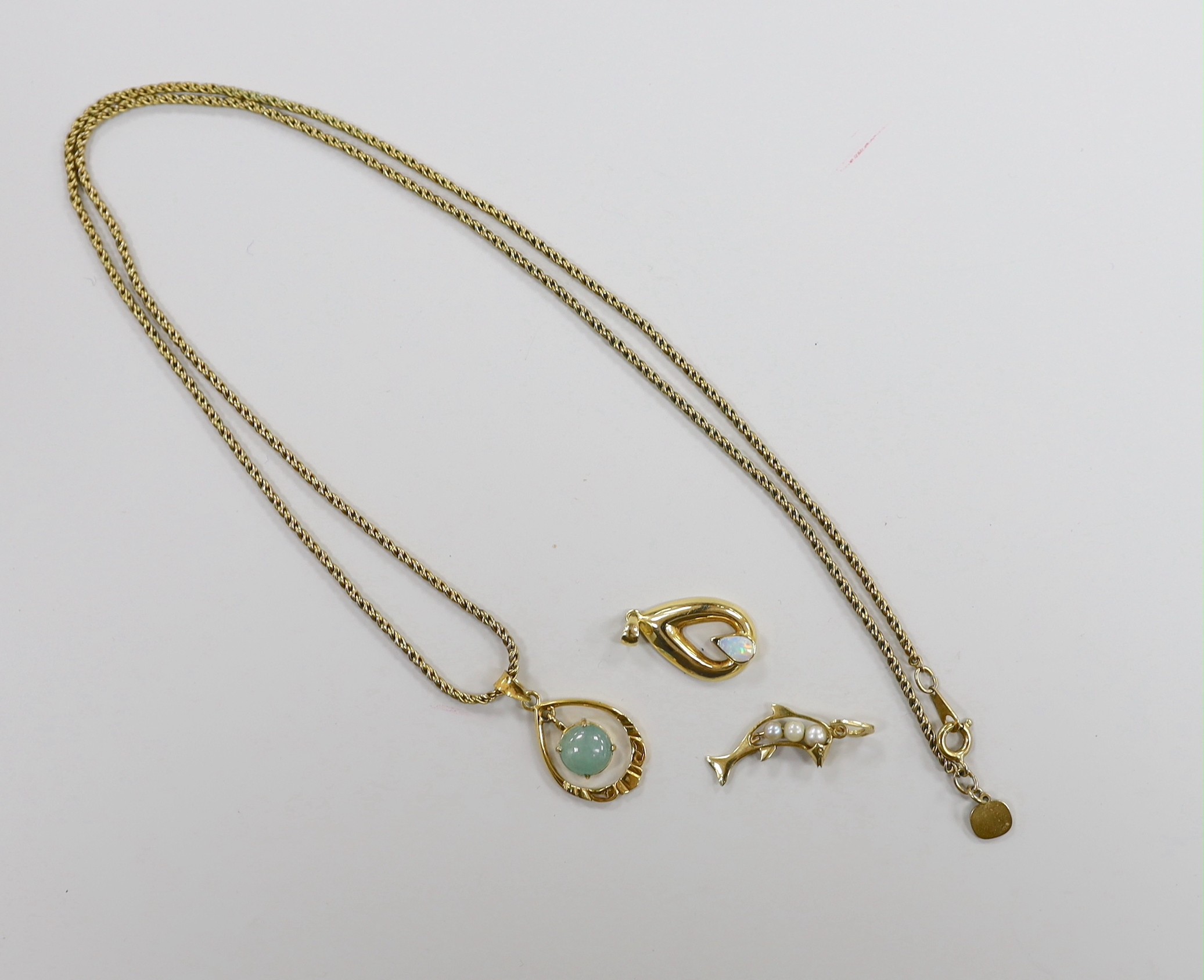 Three modern 18k and gem set small pendants, including cultured pearl set dolphin, overall 28mm and white opal set pear shape, one with gilt metal chain.